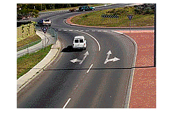 You wish to go straight ahead on this roundabout with two lanes.  Which lane may you use?