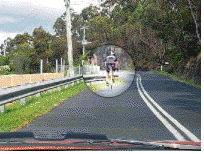 When the road is marked this way are you permitted to cross the lines to overtake the bicycle rider if the way forward is clear?