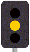 As you approach an intersection with traffic lights, the yellow light turns to red. You must-